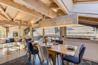 a dining room with a table and chairs at Chalet d'Olivier - Alpes Travel - Les Praz (Sleeps 8) in Chamonix-Mont-Blanc