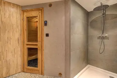 a bathroom with a shower and a tub at Chalet d'Olivier - Alpes Travel - Les Praz (Sleeps 8) in Chamonix-Mont-Blanc