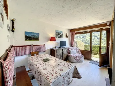 a room with a table and a chair and a desk at Studio Cabine pour 4 Pers à Deux Pas du Domaine Evasion Megève - FR-1-560-104 in Demi-Quartier