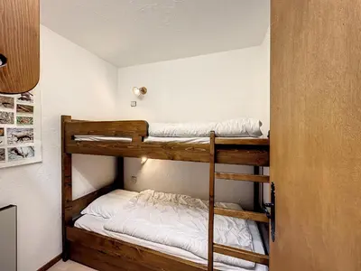 a bedroom with two bunk beds in a room at Studio Cabine pour 4 Pers à Deux Pas du Domaine Evasion Megève - FR-1-560-104 in Demi-Quartier