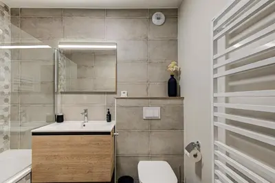 a bathroom with a sink and a toilet and a tub at White Pearl A02 - Alpes Travel - Chamonix - Sleeps 4 in Chamonix-Mont-Blanc