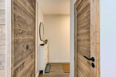 a sliding barn door in a home with a hallway at White Pearl A02 - Alpes Travel - Chamonix - Sleeps 4 in Chamonix-Mont-Blanc
