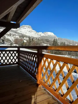 a balcony with a view of the mountains at Chalet neuf La Perle du Perron in Cordon