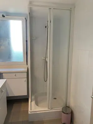 a shower with a glass door in a bathroom at Duplex St Gervais rooftop - 500m des télécabines in Saint-Gervais-les-Bains