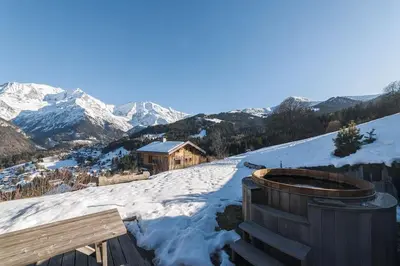 a view of a mountain range from a reservoir at L'ivresse du Mont-Blanc in Saint-Gervais-les-Bains