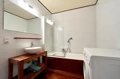 a bathroom with a sink and a bath tub at Évasion au Sommet in Combloux